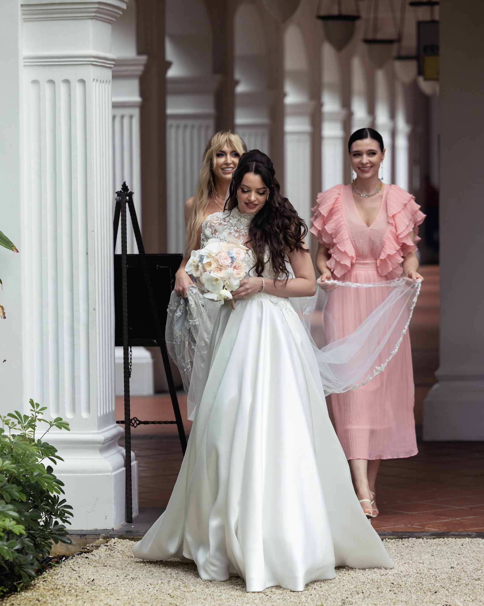 Luxury wedding floral installation โ white grand piano submerged in thousands of blush and pink roses and ranunculus โ Alina & Slava, Raffles Hotel Singapore, S$250k bespoke floral design by Tomas De Bruyne and Create Your Story